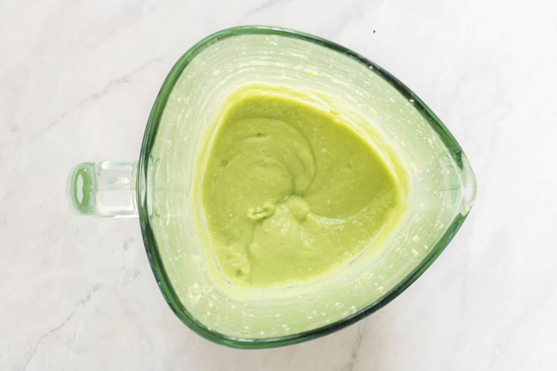 Smooth avocado sauce in blender.