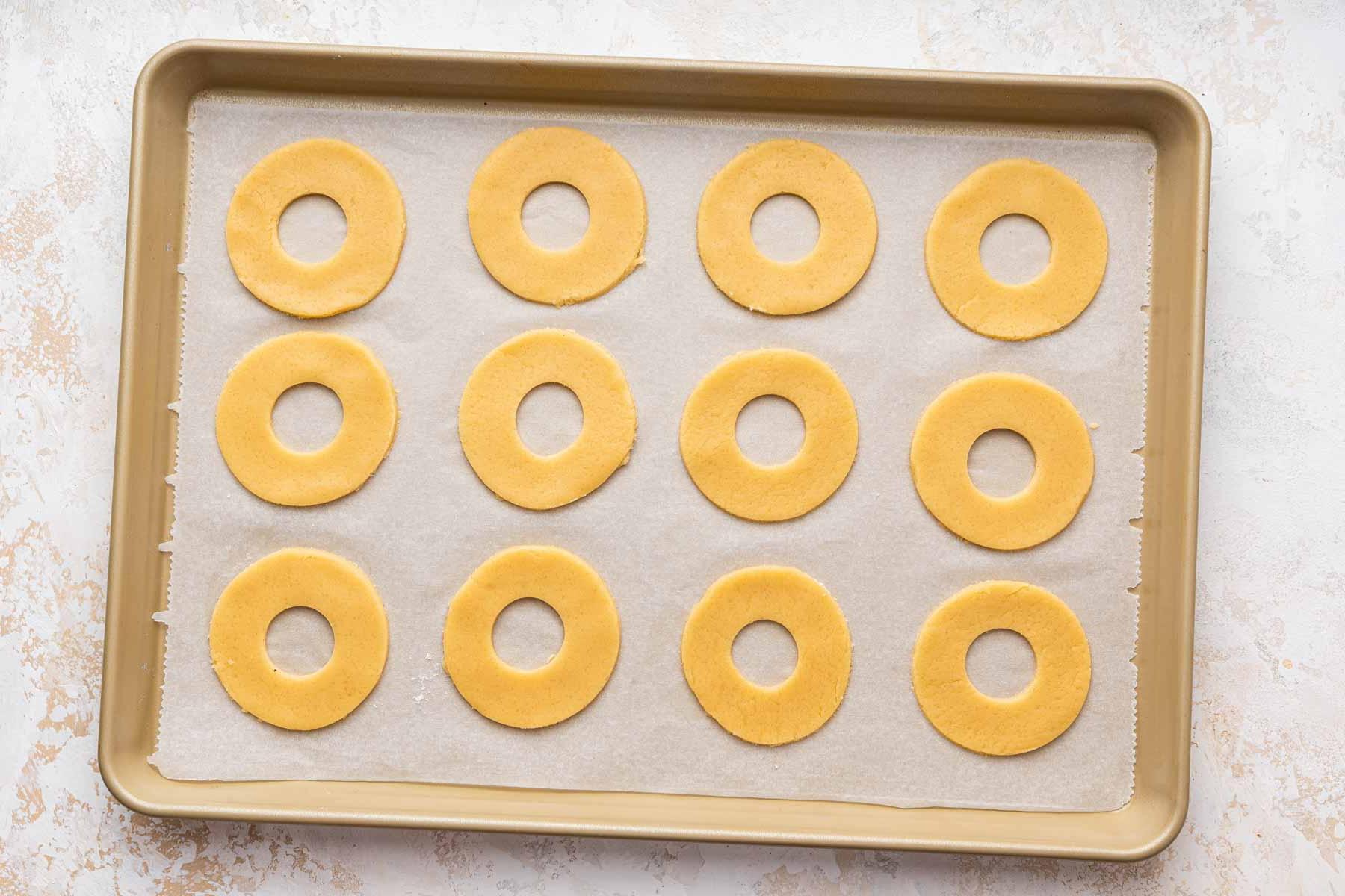 Biscotti Ciambella 10 Donut shaped cookies on baking sheet.
