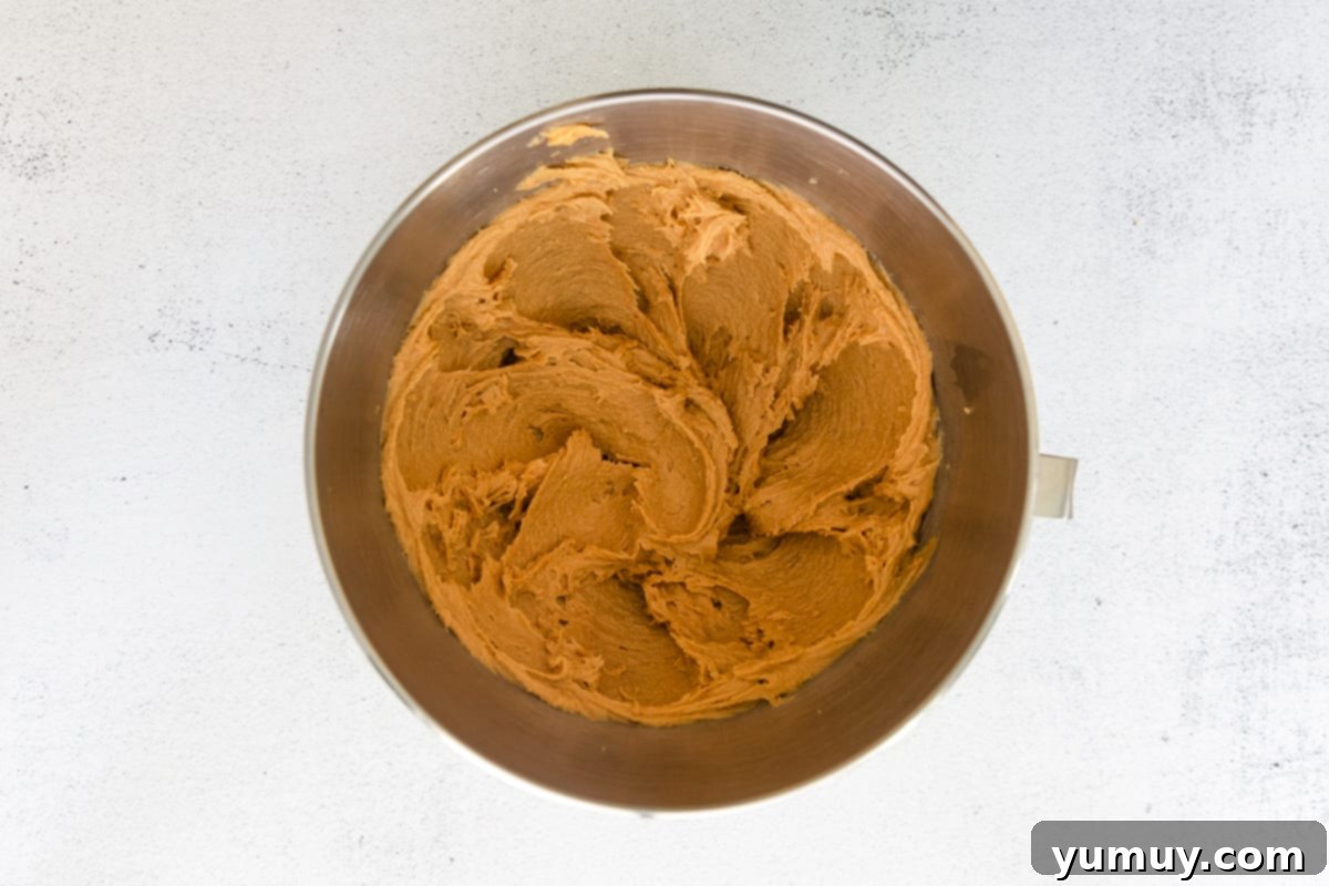 Spooktacular Monster Cookies 11 Creamed peanut butter in a mixing bowl.