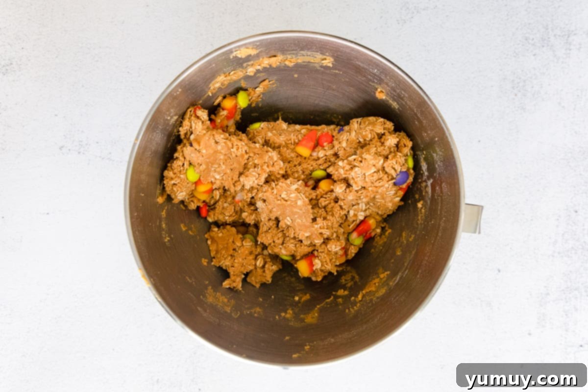 Spooktacular Monster Cookies 13 Cookie dough mixture filled with Halloween candy.