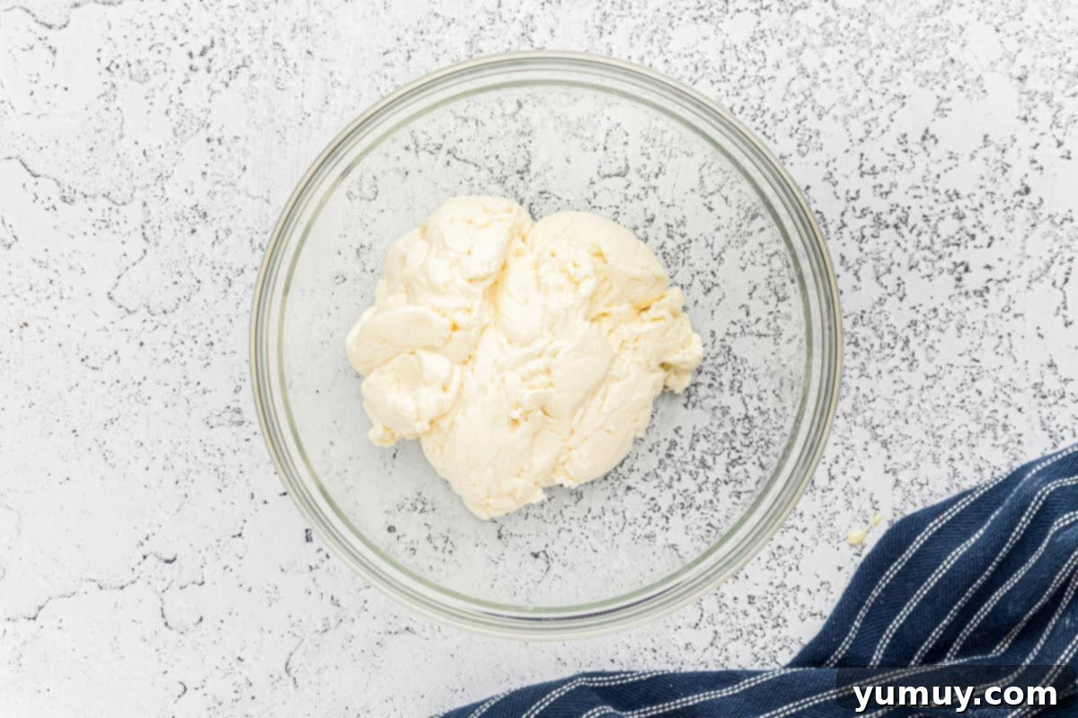 The creamy peppermint filling after all powdered sugar has been added, showing a thick, workable dough consistency.
