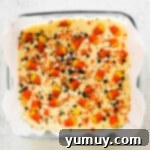 Haunted Fudge Delights 8 Step-by-step photos for how to make Halloween fudge, showing completed fudge topped with candy corn and sprinkles.