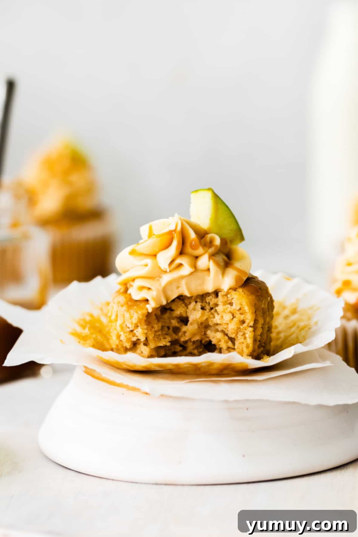 caramel apple cupcake with a bite taken