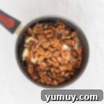 Pecan pie filling ingredients in a saucepan.