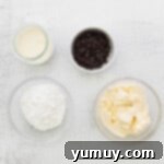 Cannoli Dream Cupcakes 7 Mixing ricotta cheese, powdered sugar, and vanilla for the cannoli cupcake filling.