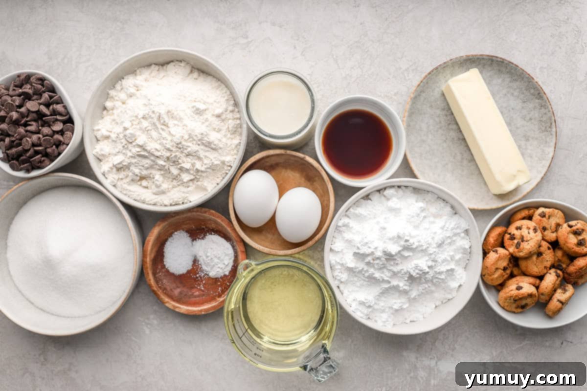 Ultimate Chocolate Chip Cupcakes 5 All the essential ingredients for creating delectable chocolate chip cupcakes, meticulously arranged in separate dishes on a clean counter.