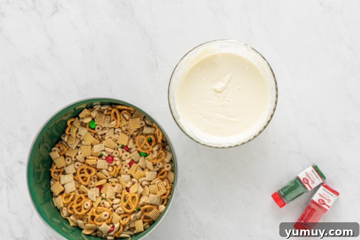 Melted white chocolate chips in a microwave-safe bowl, smooth and ready to coat the Chex mix.