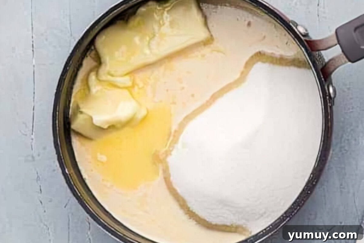 Butterfinger Bliss Fudge 11 Butter, sugar, and evaporated milk melting and simmering in a saucepan