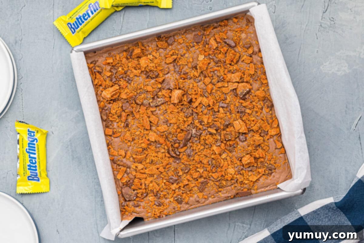 Butterfinger Bliss Fudge 15 Butterfinger fudge in a baking dish, completely set and ready for slicing