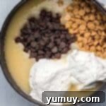 Butterfinger Bliss Fudge 6 Marshmallow fluff, chocolate chips, and peanut butter chips added to hot fudge mixture