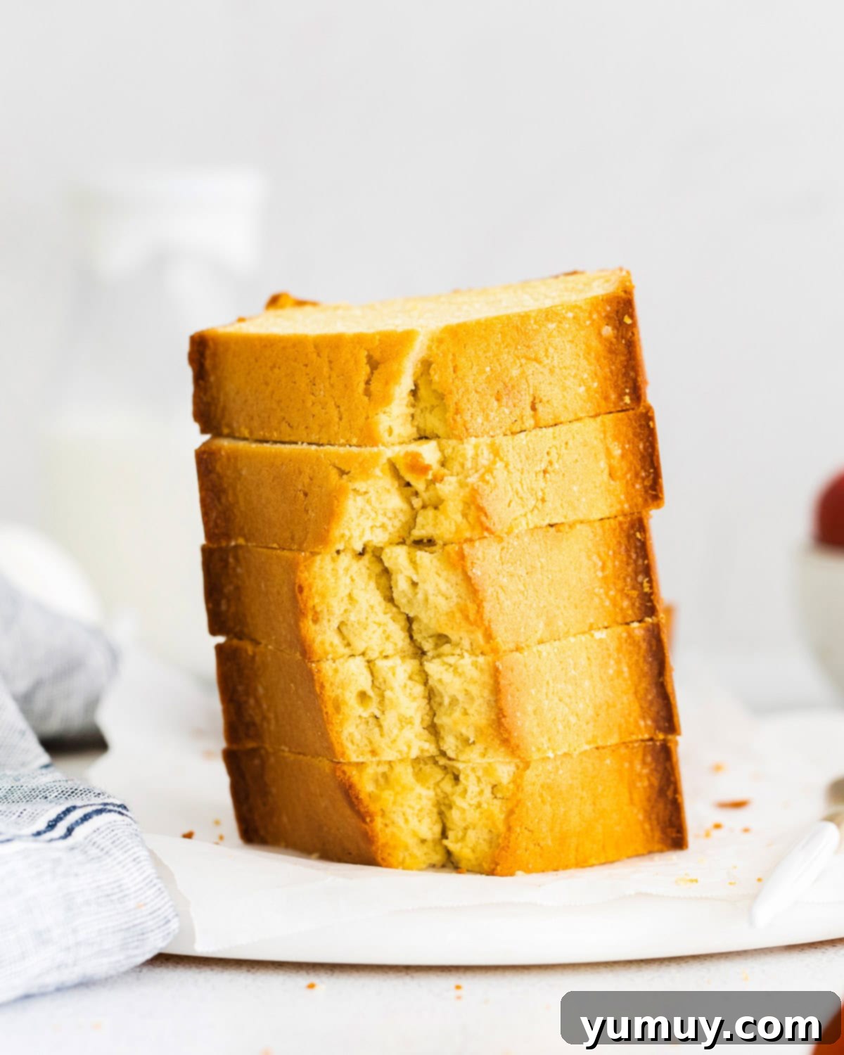 Classic Vanilla Pound Cake 3 vertically stacked slices of vanilla pound cake.
