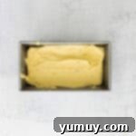 Classic Vanilla Pound Cake 9 vanilla pound cake batter in a loaf pan.