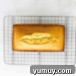 Classic Vanilla Pound Cake 10 overhead view of baked vanilla pound cake on a wire cooling rack.