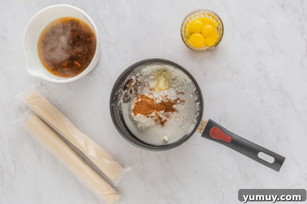 Velvet Raisin Bliss 19 All the custard ingredients, including sugar, sour cream, cornstarch, butter, lemon juice, salt, and cinnamon, perfectly combined in a saucepan.