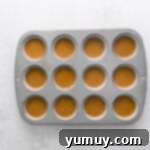 Spiced Gingerbread Cupcakes 7 gingerbread cupcake batter in a cupcake pan before baking