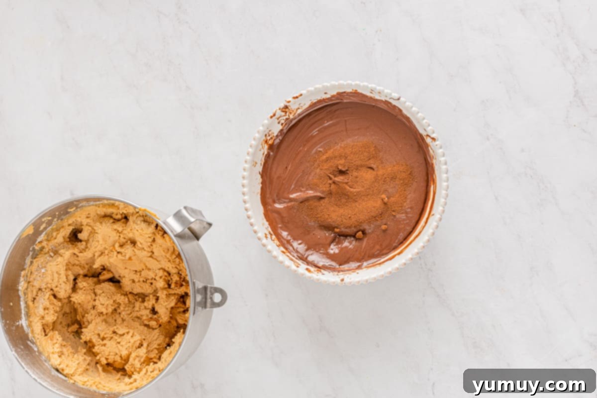 Velvety smooth melted chocolate coating in a pristine white bowl, ready for dipping.