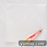 cream cheese mixture and red food coloring stripes in a piping bag