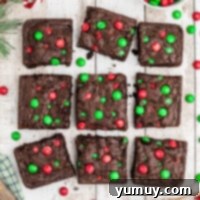 Featured image of Christmas M&M brownies, a close-up highlighting the candies.