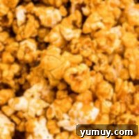 Golden Caramel Crunch 4 closeup view of pieces of caramel popcorn.