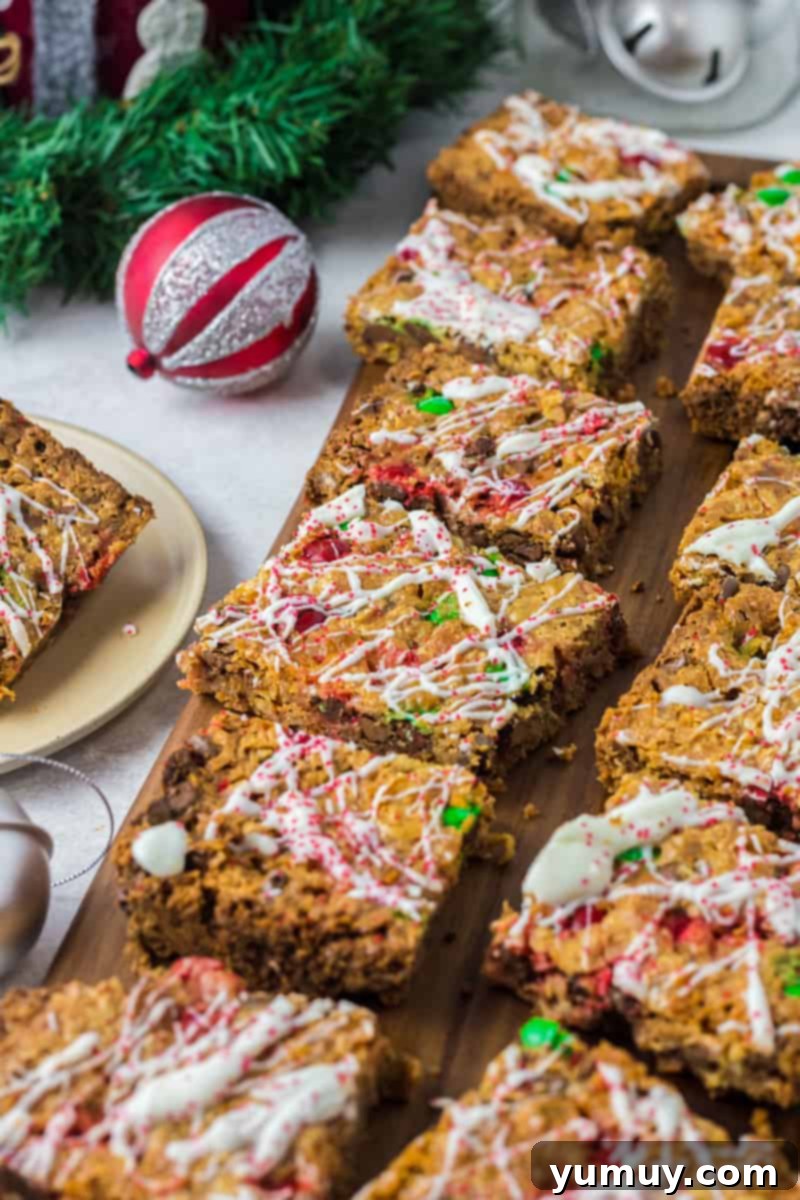 christmas 7 layer magic cookie bars on a wood board
