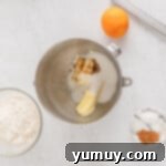 Holiday Wreath Delights 6 Cookie dough ingredients in a mixing bowl being creamed together.