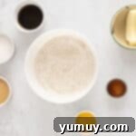 Festive Gingerbread Treats 6 Mixed dry ingredients for gingerbread cookies in a white bowl, ready for the wet ingredients.