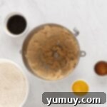 Festive Gingerbread Treats 7 Creamed butter and sugar mixture in a stainless steel mixing bowl, light and fluffy.