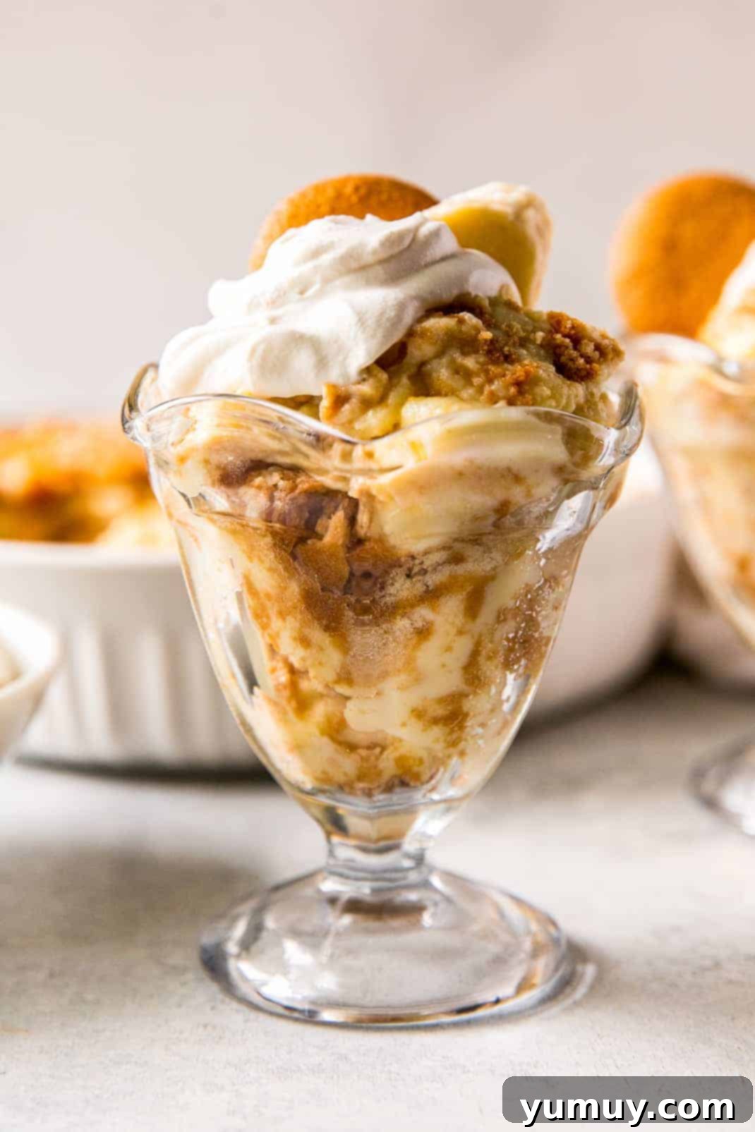 up close banana pudding in parfait dish with whipped cream