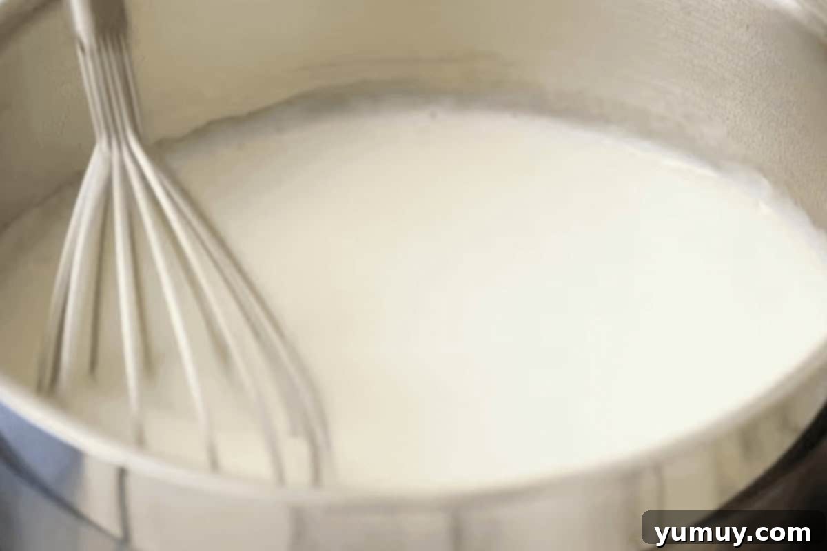 whisking flour, sugar, and milk in a saucepan.