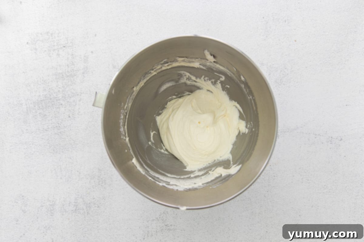 Lush, white marshmallow creme filling, perfectly mixed and waiting in a metal bowl.