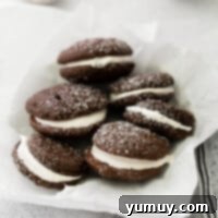 Featured image of two chocolate whoopie pies, perfectly assembled and ready to eat.