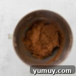 Smooth chocolate whoopie pie batter in a metal bowl, perfectly mixed and ready for baking.