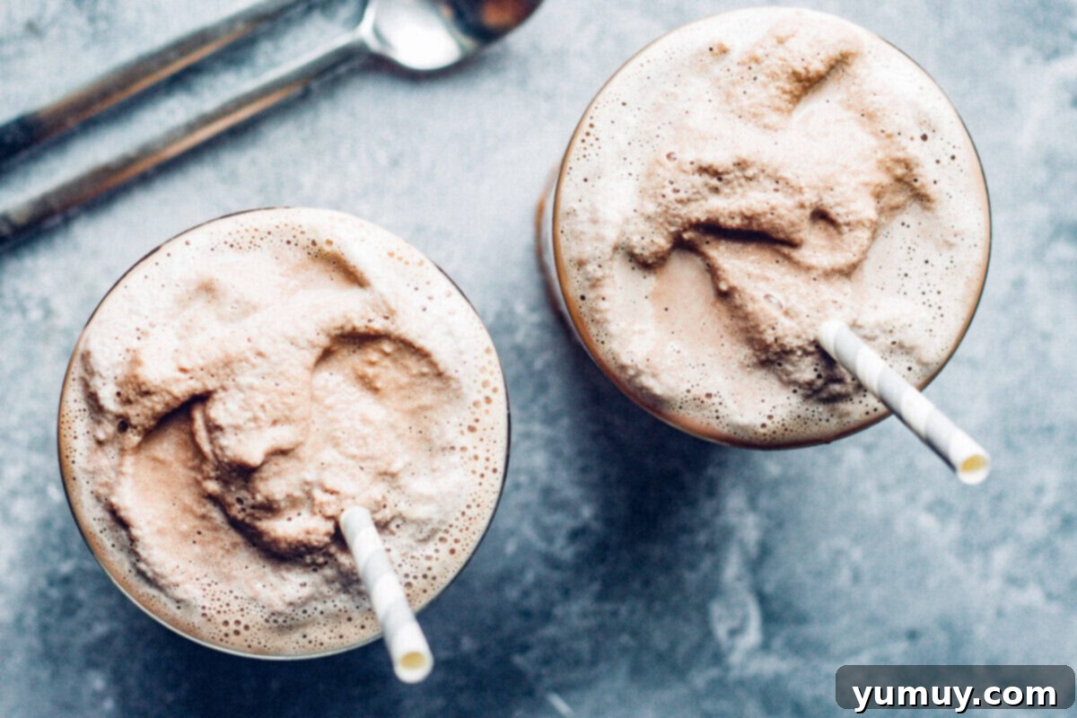 Make Your Own Wendy's Chocolate Frosty at Home 7 Overhead view of two glasses of homemade chocolate frosty, complete with straws, ready to be enjoyed.
