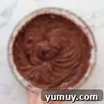 Bite Sized Chocolate Delights 5 Chocolate cake batter in a glass mixing bowl.