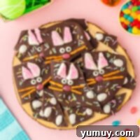 pieces of easter bunny chocolate bark on a wood board