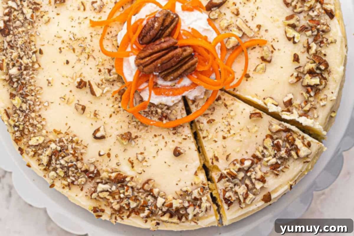 Cropped overhead view of a delicious carrot cake cheesecake with a perfect slice cut out, showing the distinct, moist layers.