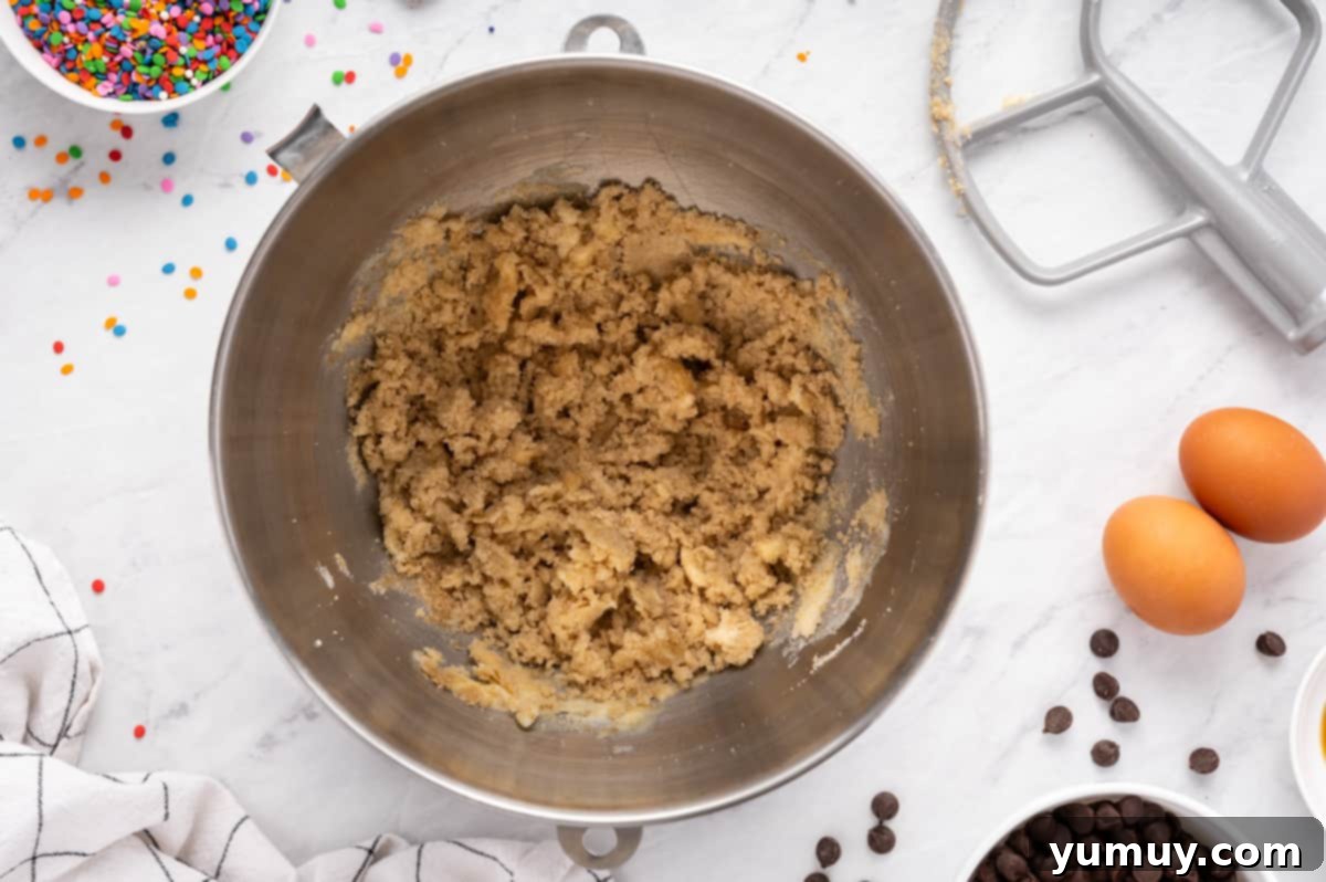 The Legendary Chocolate Chip Cookie Cake 17 creamed butter and sugars in a metal bowl