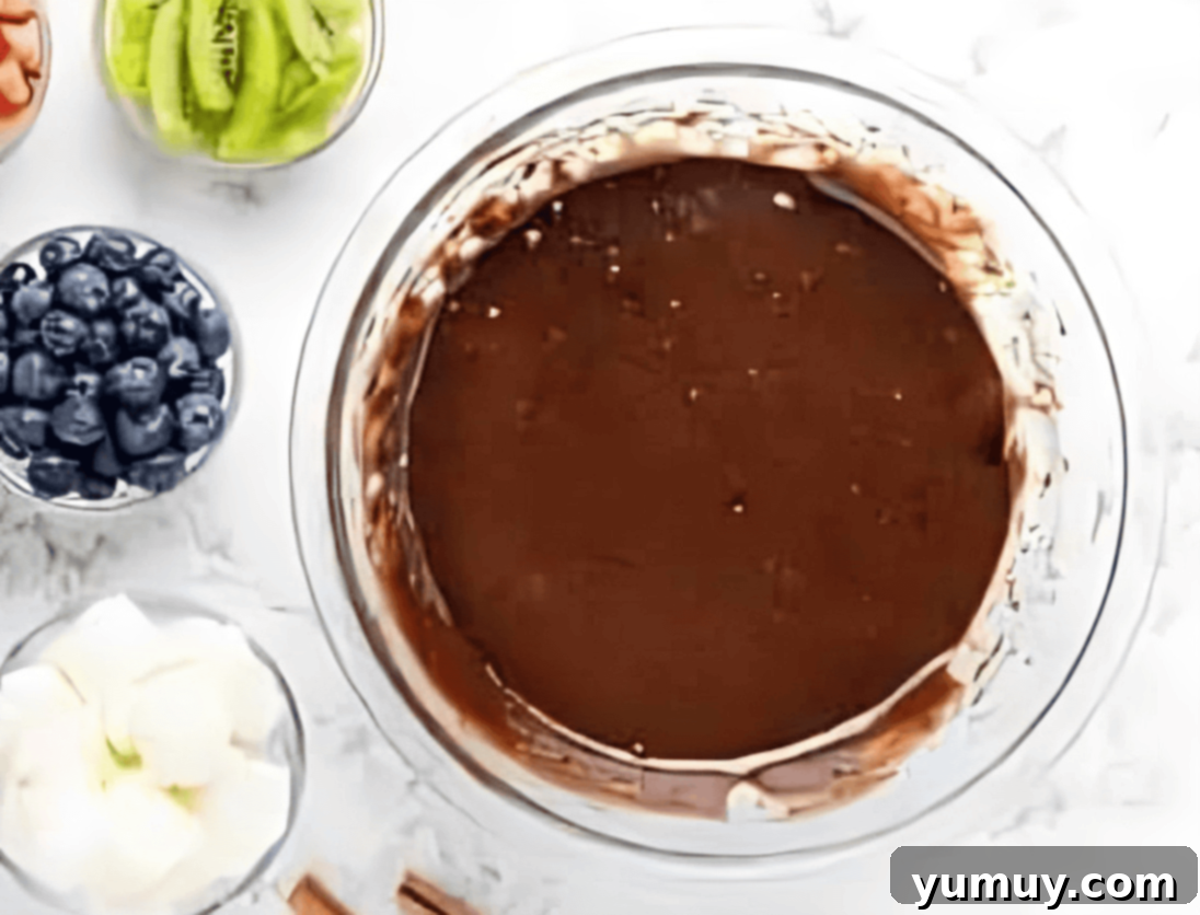 Jeweled Brownie Fruit Tart 12 brownie batter in a glass bowl.