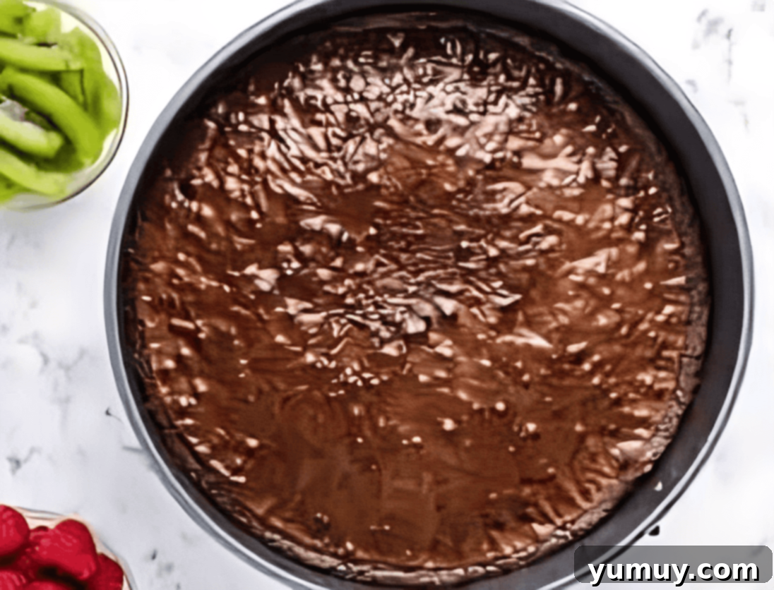 Jeweled Brownie Fruit Tart 14 baked brownies in a round springform pan.