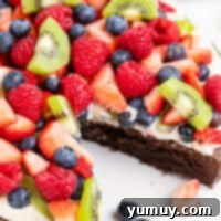 Jeweled Brownie Fruit Tart 4 brownie fruit pizza topped with cream and sliced fruit