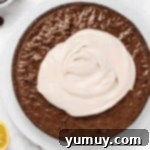 Jeweled Brownie Fruit Tart 9 frosting a brownie.