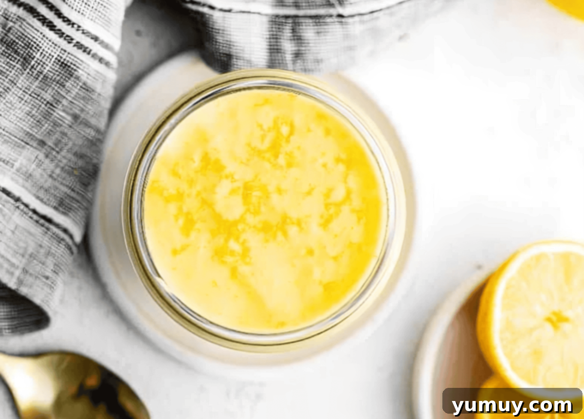 Homemade Lemon Curd: Bright, Tangy Perfection 11 A glass jar filled with golden, set lemon curd, ready for storage.