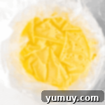 Homemade Lemon Curd: Bright, Tangy Perfection 6 Plastic wrap pressed directly on top of the warm lemon curd to prevent a skin from forming.