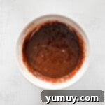 Mint Chocolate Peak Cupcakes 5 Andes mint cupcake batter in a white bowl, showing the consistency before adding dry mix