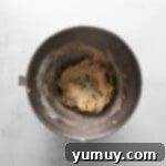 Decadent Chocolate Chip Cheesecake Squares 6 chocolate chip cookie dough in a metal bowl