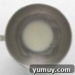 Berry Bliss Macarons 6 egg whites and sugar in a mixing bowl.