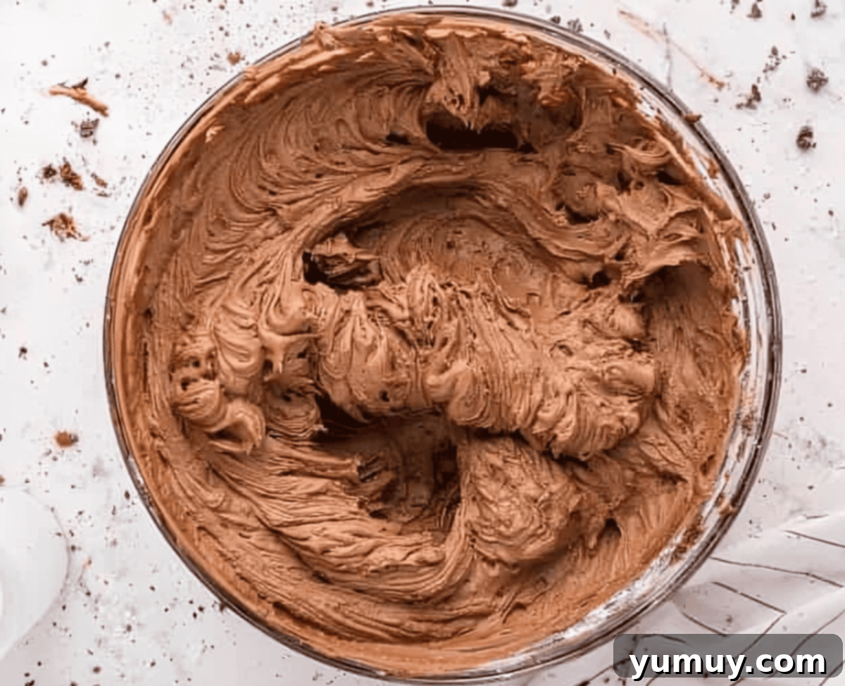 Velvet Chocolate Buttercream 12 chocolate buttercream frosting in a glass bowl.