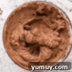 Velvet Chocolate Buttercream 7 chocolate buttercream frosting in a glass bowl.