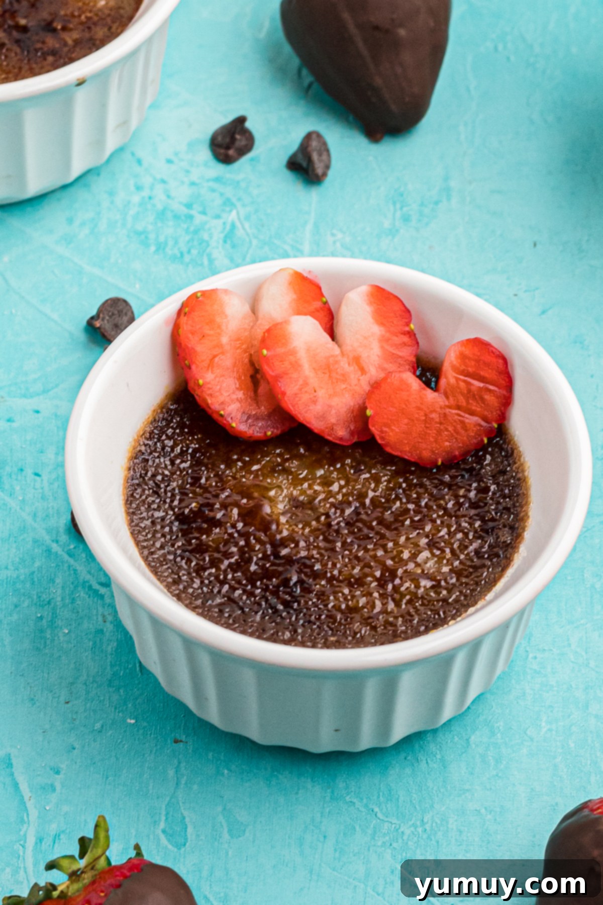 white ramekins with chocolate creme brulee