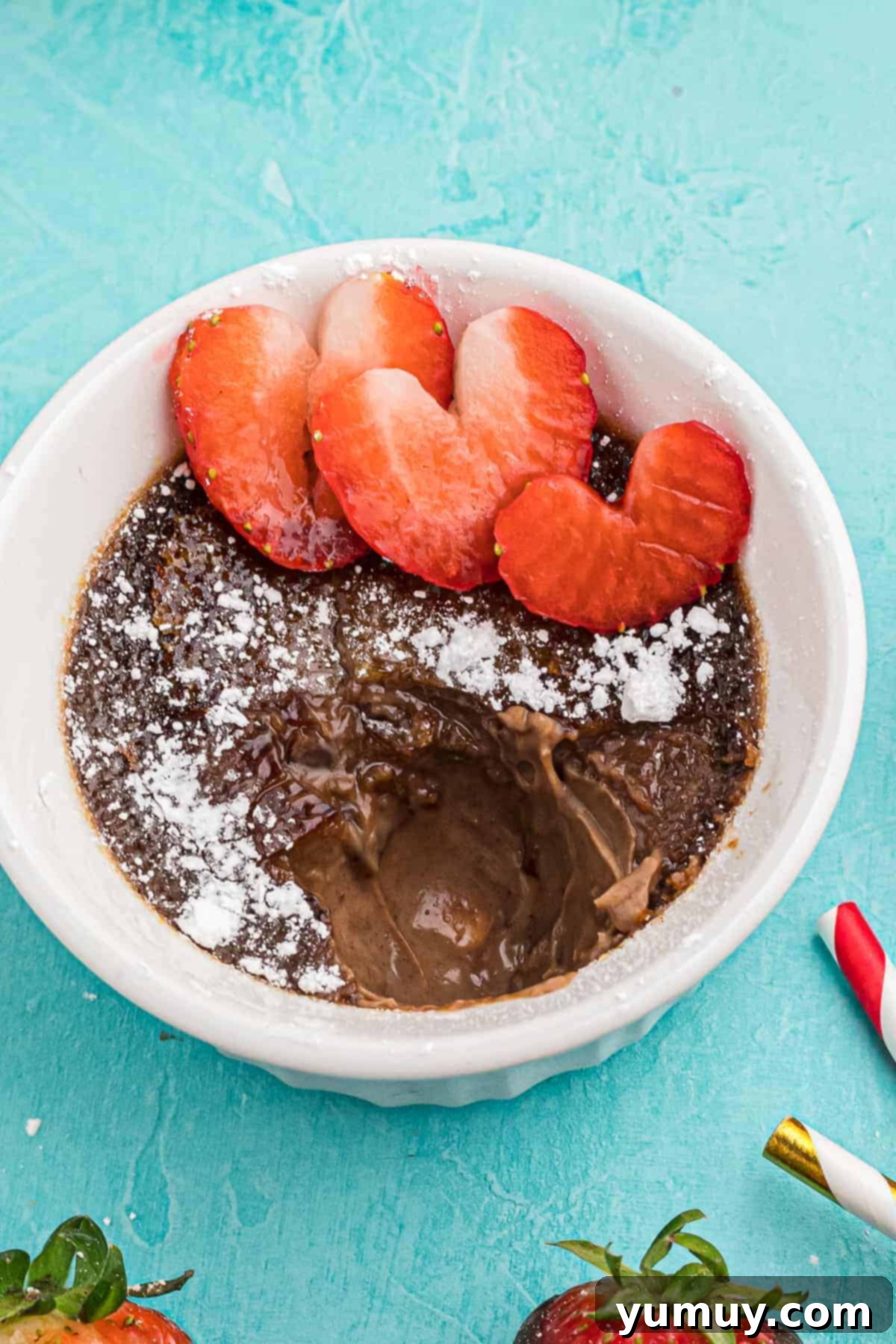 chocolate creme brulee with strawberries and powdered sugar